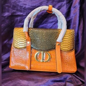 Orange croc and snake embossed handbag